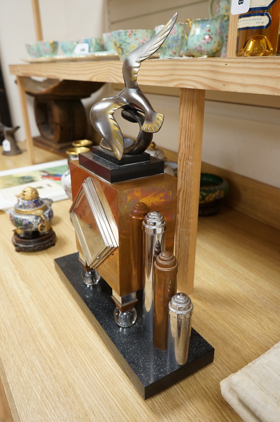An French Art Deco copper and chrome mantel clock, with bronze seagull surmount, 57cm high